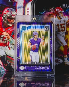 2024 Panini Donruss Optic #235 J.J. McCarthy Purple Shock Prizm Rookie - Picture 1 of 2