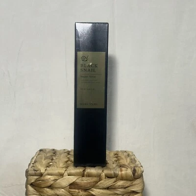 Tónico reparador de caracoles negros Holika Holika 3,38 fl oz - líquido hidratante para rostro Foto 1 de 2