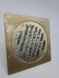 Rejilla de drenaje de ducha de azulejos de latón macizo de 4" con válvula de retención nueva caja abierta. - Imagen 1 de 7
