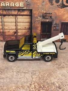 Matchbox 1987 GMC Wrecker Yellow & Black With Graphics 24 Hour Towing Loose Nice - Picture 1 of 5