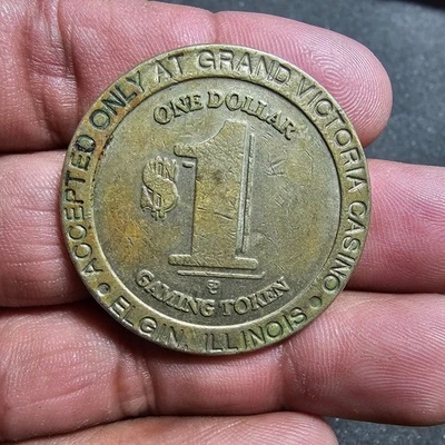 Vintage Grand Victoria Casino Elgin Illinois $1 Gaming Token Brass Coin shows si - Image 1 of 4