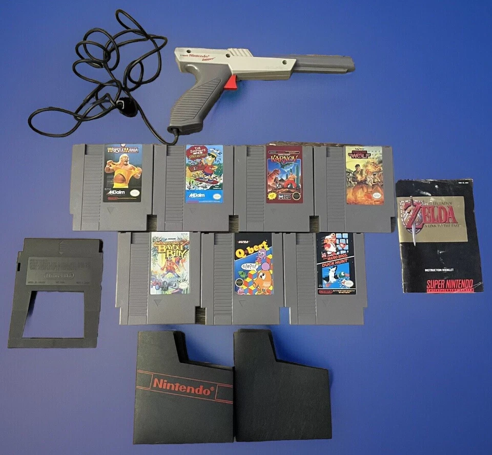 7 Nintendo Games, Control Deck Cleaner, 7 Authentic Dust Covers, 1985 Zapper Gun - Image 1 of 1
