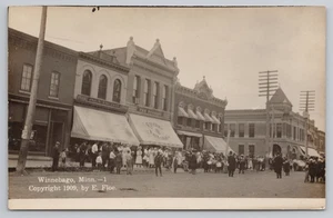 Postcard RPPC 1909 Parade with Street View in Winnebago, MN. - Picture 1 of 2