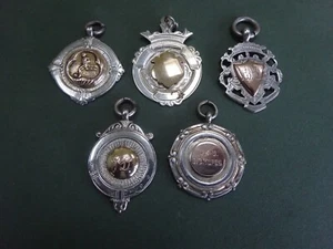 FIVE ASSORTED SILVER FOB MEDALS WITH GOLD INFILL CENTRES - Picture 1 of 7