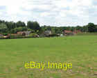 Photo 6x4 Houses in the village of Hapton View across paddock towards hou c2009