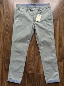 Chinos Ted Baker “Buggles” delgados/rectos W34 L31 verde salvia nuevos con etiquetas precio de venta sugerido por el fabricante 119 GBP - Imagen 1 de 16