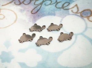 5pz ciondoli tartarughe in acciaio inox 15x9mm colore argento scuro bijoux - Foto 1 di 1