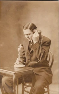 Young man talking on stick phone undivided backpostcard a123 - Bild 1 von 2