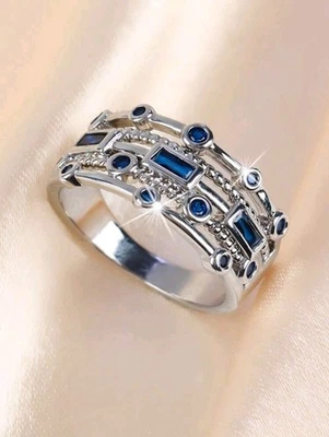 Anillo/banda plateada de circonita cúbica azul cobre talla 6 Foto 1 de 2