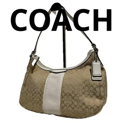 Bolsa de accesorios COACH Signature lona beige A28 Foto 1 de 4