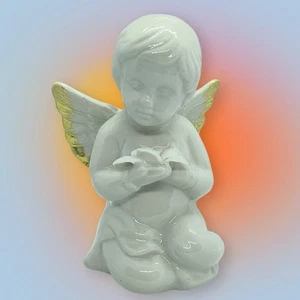 Estatuilla blanca cremosa de cerámica con alas y flores bebé querubín bebé ángel vintage - Imagen 1 de 16