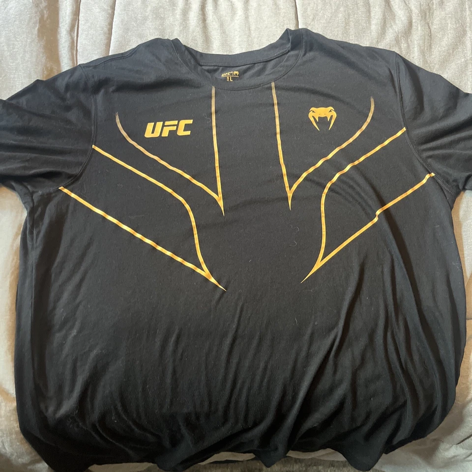 Camiseta réplica Venum UFC Fight Night 2.0 - Campeón Foto 1 de 2
