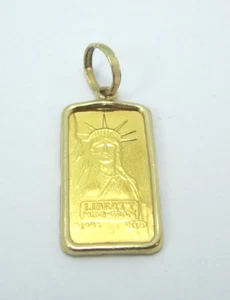 IMPRESIONANTE BISEL 14K CON COLGANTE ESTATUA DE LA LIBERTAD 1985 1 GRAMO .999 1.2G - Imagen 1 de 7