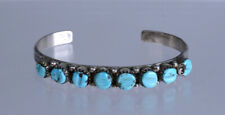 Zuni Row with 8 carved turquoise settings