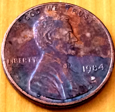 1984 D Lincoln Cent, Magenta ,bluish black toning, Double Ear Letters Date , RPM - Image 1 of 4