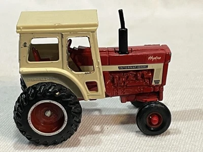 ERTL 1/64 International 966 w/ Deluxe Red Cab, White stripe, Red Farm Tractor - Image 1 of 4