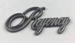 1985 1986 1987 1988 OLDSMOBILE REGENCY SCRIPT PLASTIC EMBLEM Badge Logo 22521890 - Picture 1 of 3