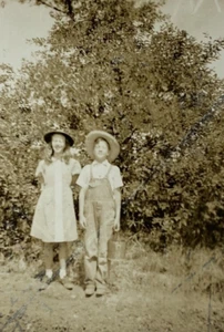 Girl Standing By Boy In Overalls & Straw Hat B&W Photograph 2.5 x 3.5 - Picture 1 of 3