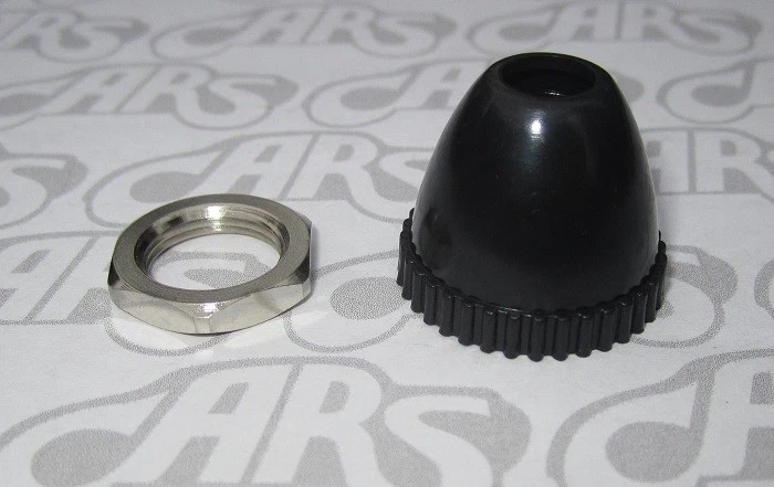 Tuerca y retenedor de antena Chevrolet 1955-1957. Plástico negro. Nuevo.  Foto 1 de 1