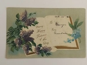Postcard Greetings Many Happy Returns Of The Day Lilacs Book Embossed c1908 - Picture 1 of 2