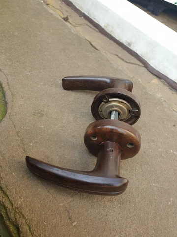 One pair of Old/vintage bakelite everite lever door handles with spring & screws Cover
