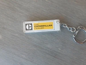VINTAGE  keychain  KEYRING  UW CATERPILLAR DEALER geveKE OLD PLASTIC  - Picture 1 of 2