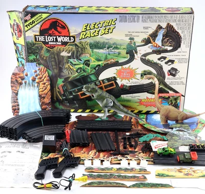 Juego de carreras de coches eléctricos Tyco Jurassic Park Lost World 1997 de colección con coches T-Rex Foto 1 de 4