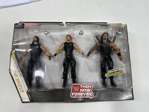 THE SHIELD WWE Elite Then Now Forever Seth Rollins Dean Ambrose Roman Reigns NUOVO - Foto 1 di 3