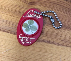 VINTAGE LUCKY GENUINE FOUR LEAF CLOVER KEYCHAIN AND FOB GEORGE MILLER CHEVROLET - Picture 1 of 2