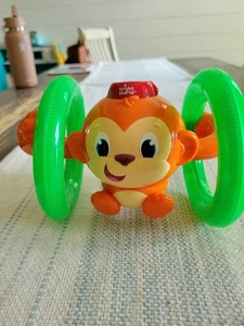 Bright Starts Roll & Glow Monkey Toy with Lights and Melodies, Ages 6 months + - Picture 1 of 1