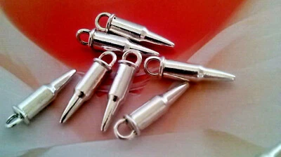 35 CIONDOLI CHARM PROIETTILI - HOBBY CREATIVI - IN ARGENTO TIBETANO . NUOVI - Immagine 1 di 2