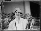 Tennis player Daphne Akhurst Cozens in a garden holding tennis - 1930s Old Photo