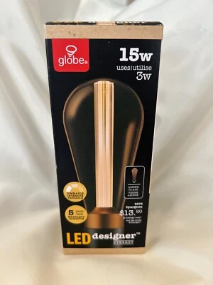 Globe Designer Lightbulb 7 in tall about 2 1/2 in copper hued  base Amber bulb - Image 1 of 4