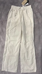Nike Pantaloni Donna Windrunner Vita Alta Tessuto Orlo Aperto Marrone |FV7655-110| - Foto 1 di 2