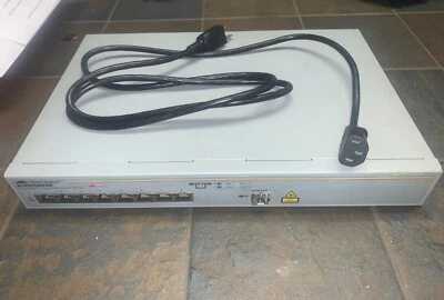 Extensión Ethernet Allied Teselyn AT-FS708/POE con astilla de cable-usada. Foto 1 de 3