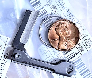NEW MINI TITANIUM FOLDING KNIFE MULTI-TOOL WITH KEYCHAIN MINIATURE TINY BLADE - Picture 1 of 6