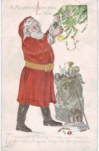 Weihnachtsmann schmückt den Baum wie besehen geknickt 1910 Weihnachten - Bild 1 von 2
