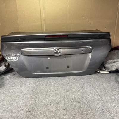 Nissan Versa 2012-2019 maletero escotilla puerta trasera cubierta tapa gris metálico sedán OEM Foto 1 de 4