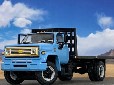 1/64 DCP BLUE CHEVY C-65 SINGLE AXLE FLATBED - Image 1 of 4