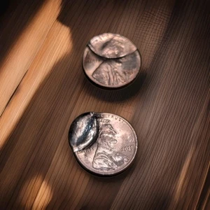2 Coins 2025 and 2010 Restruck Or Damaged  - Picture 1 of 4