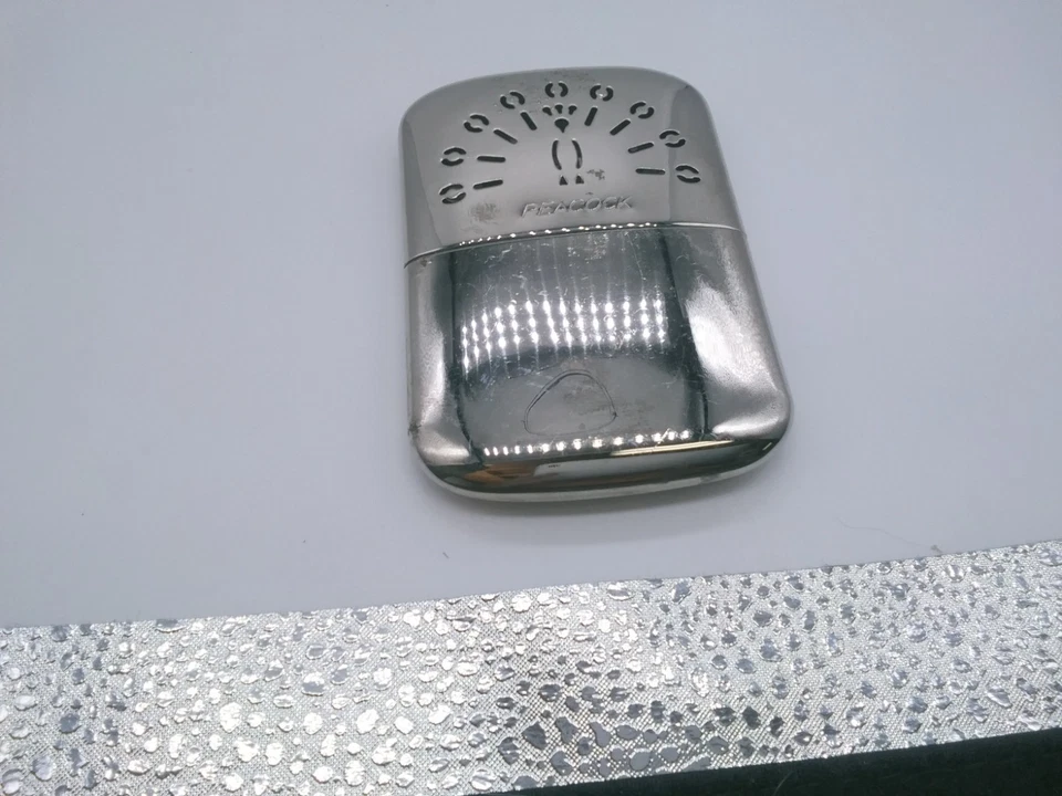 Calentador de manos cromado marca Peacock hecho en Japón Foto 1 de 4