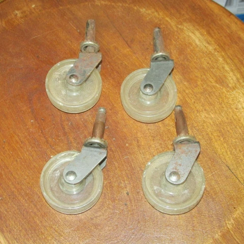 4 Matching Vintage Plastic Furniture Casters with 2 Inch Wheel & Pin Sleeves Cover