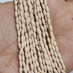 14 Strings, 5x2mm Off White Acrylic Oval Beads - Picture 1 of 8