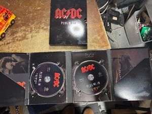 AC/DC - Plug Me In (DVD, 2007, 2-Disc Set) with original booklets/case/sleeve! - Picture 1 of 3