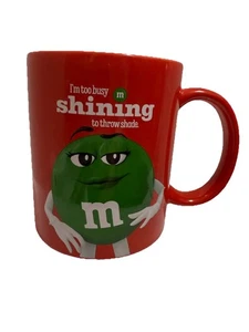 M&M's Green M&M I'm too Busy Shining to Throw Shade Red Coffee Cup Mug - Picture 1 of 5