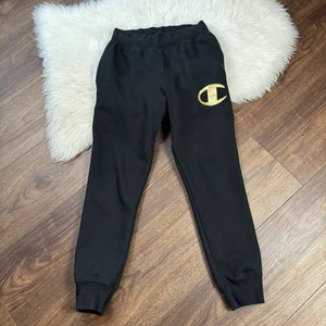 Champion sportliche Jogginghose Damen mitteldick warm schwarz mit goldenem Logo  - Bild 1 von 9