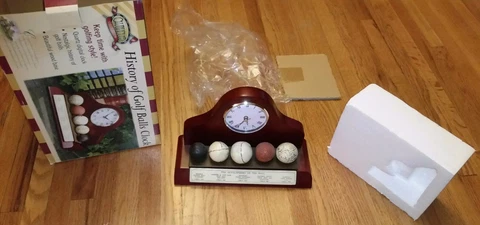 History of Golf Balls Clock- Working NIB Tested Cover