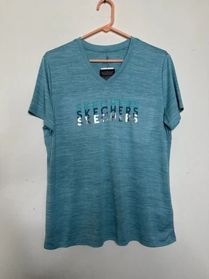 Sketchers Mujer Grande NUEVA Camiseta Verde Azulado Jaspeada Secado Rápido Gráfico Cuello en V Foto 1 de 4