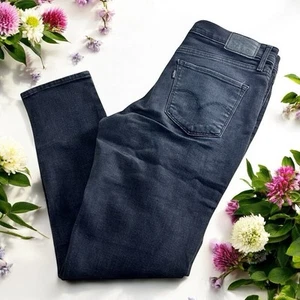 Pantalones de mezclilla negros ajustados para mujer Levis 311 talla 30 elásticos 28" entrepierna tiro medio - Imagen 1 de 6