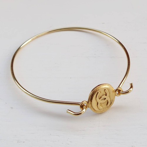Bracciale CHANEL COCO Mark rotondo reversibile charm piccolo bottone marchio cocco